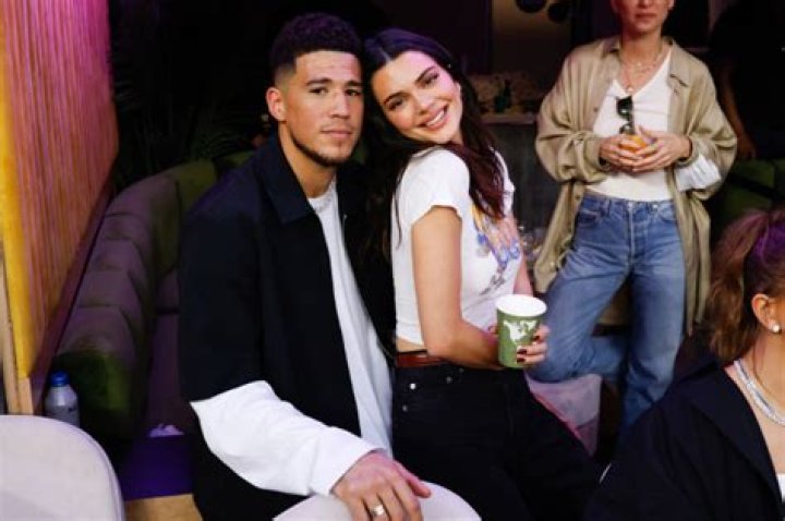 Kendall Jenner Sits On Devin Booker’s Lap In Black Bikini Bottoms: Photo
